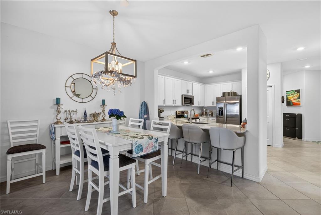 2323 Dragonfruit Way Naples, FL 34120 - Photo 12 of 32 a view of a dining room and livingroom view
