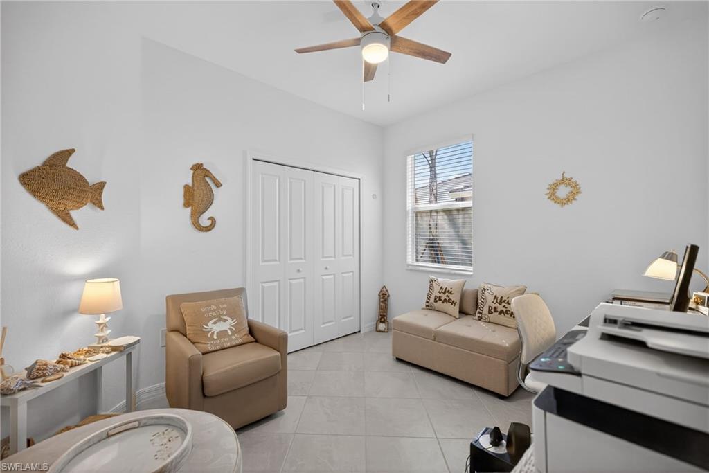 2323 Dragonfruit Way Naples, FL 34120 - Photo 18 of 32 a bedroom with furniture and a window