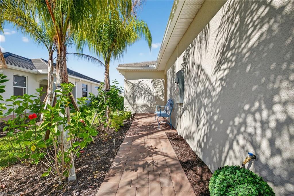 2323 Dragonfruit Way Naples, FL 34120 - Photo 2 of 32 a couple of flower plants in front of house