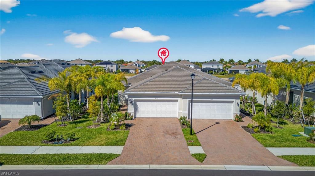 2323 Dragonfruit Way Naples, FL 34120 - Photo 22 of 32 a view of a street in front of house