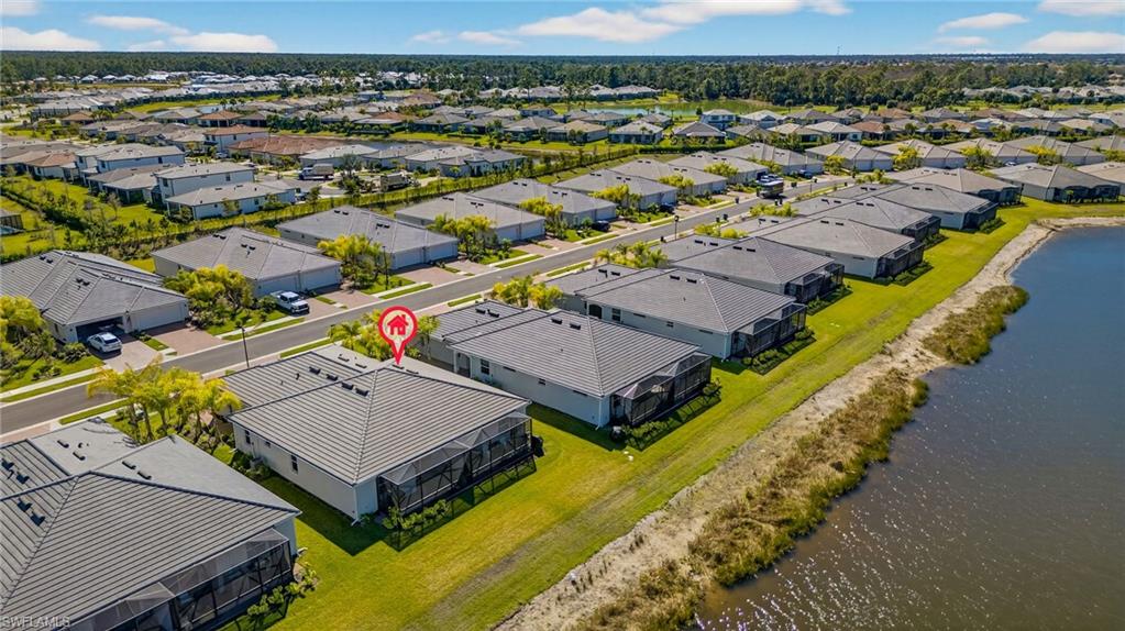 2323 Dragonfruit Way Naples, FL 34120 - Photo 25 of 32 an aerial view of a house with a big yard