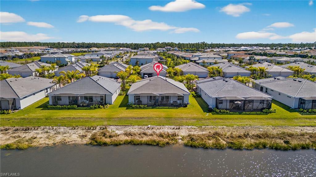 2323 Dragonfruit Way Naples, FL 34120 - Photo 26 of 32 a view of an swimming pool and outdoor space