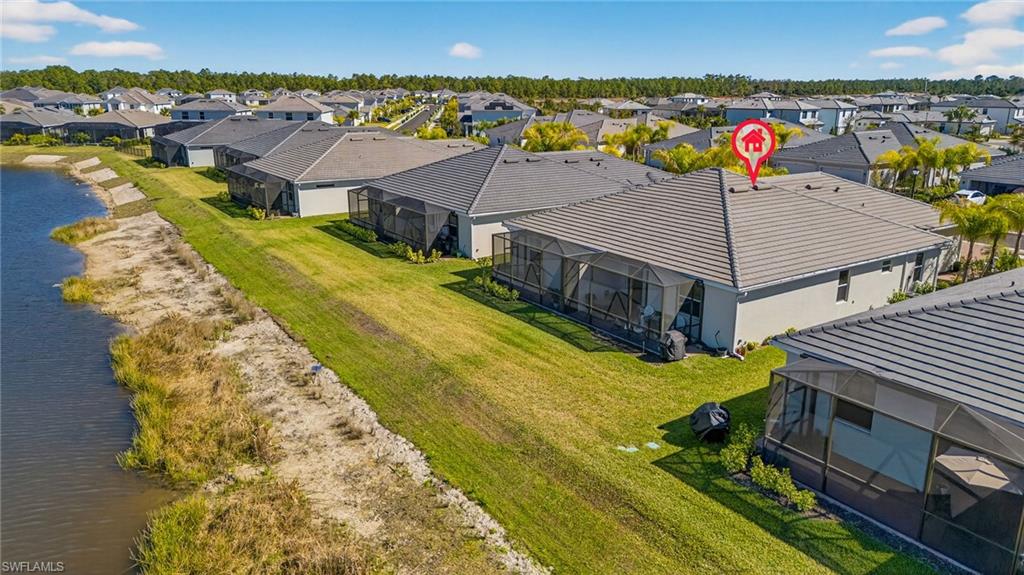 2323 Dragonfruit Way Naples, FL 34120 - Photo 27 of 32 an aerial view of residential houses with outdoor space