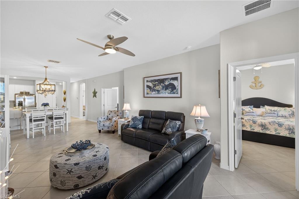 2323 Dragonfruit Way Naples, FL 34120 - Photo 5 of 32 a living room with furniture and a couch