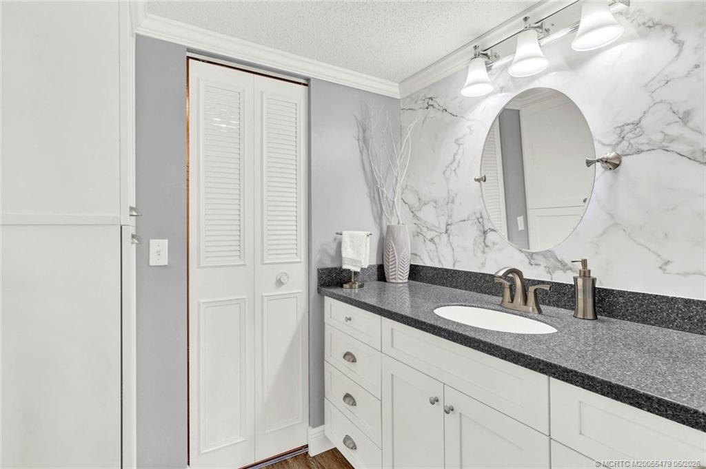 1950 Southwest Palm City Road, Unit 2102 Stuart, FL 34994 - Photo 29 of 55 a bathroom with double sink and a mirror