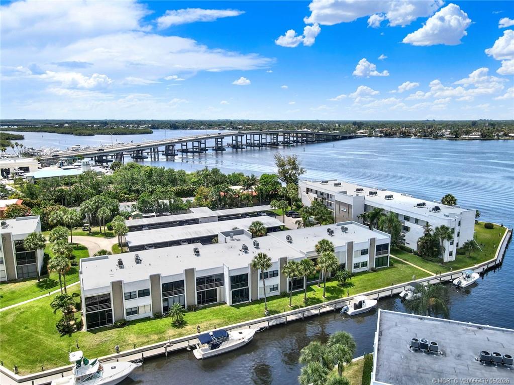 1950 Southwest Palm City Road, Unit 2102 Stuart, FL 34994 - Photo 3 of 55 a view of a city with lawn chairs