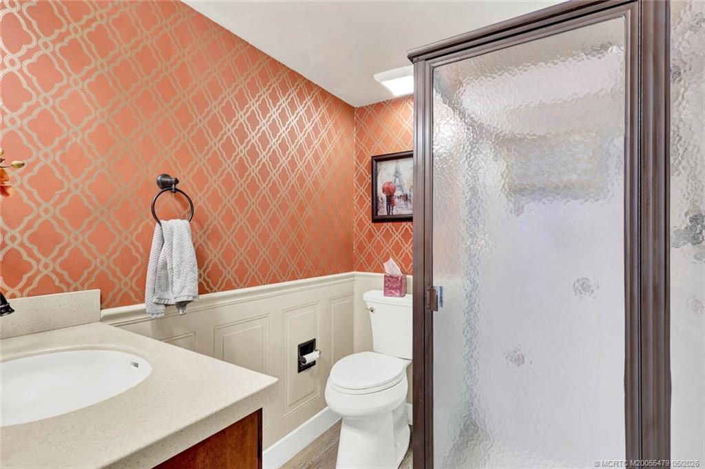 1950 Southwest Palm City Road, Unit 2102 Stuart, FL 34994 - Photo 36 of 55 a bathroom with a sink toilet and shower