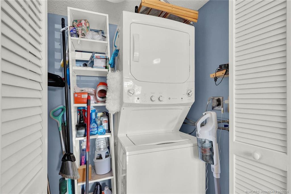 1950 Southwest Palm City Road, Unit 2102 Stuart, FL 34994 - Photo 37 of 55 a utility room with dryer and washer