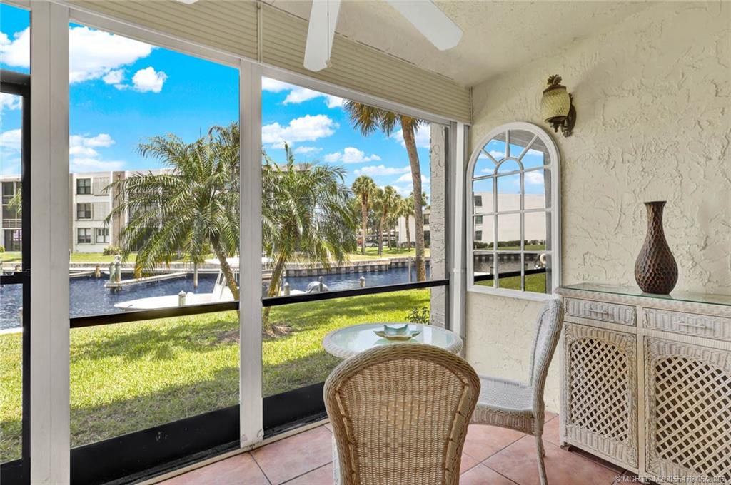 1950 Southwest Palm City Road, Unit 2102 Stuart, FL 34994 - Photo 7 of 55 a view of a living room and floor to ceiling window or wooden floor