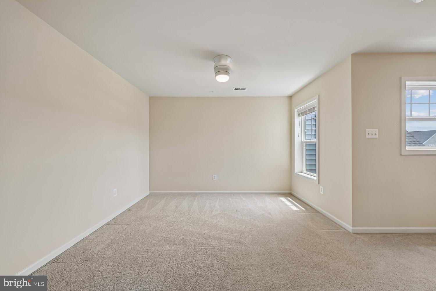 3068 Spring Peeper Court Odenton, MD 21113 - Photo 12 of 42 an empty room with windows