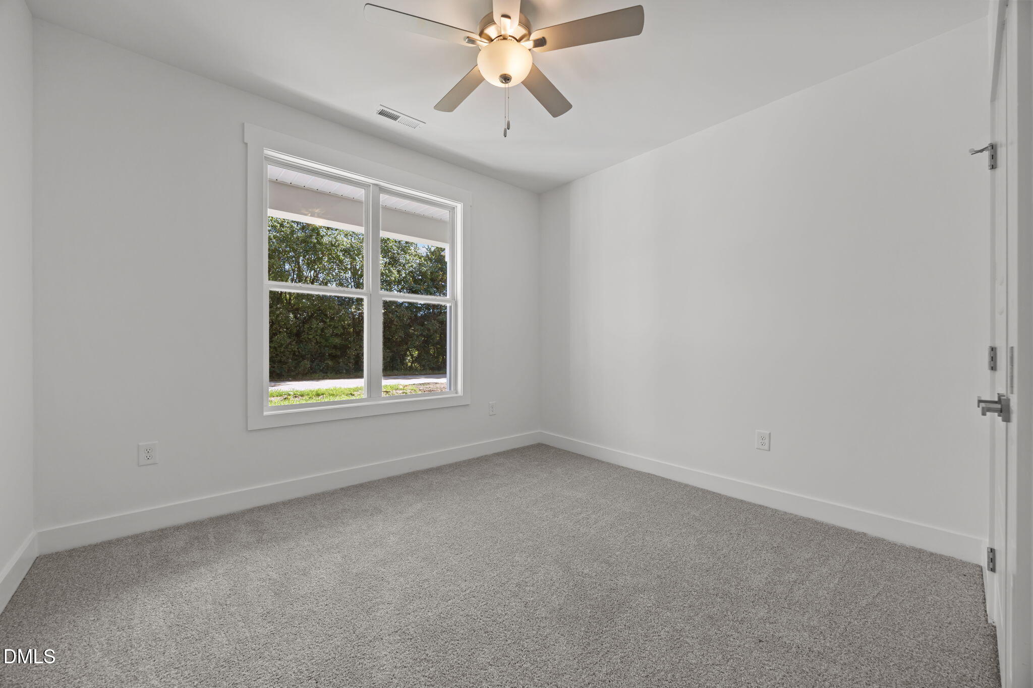 144 Howard Harris Road Franklinton, NC 27525 - Photo 15 of 21 an empty room with a window and a fan