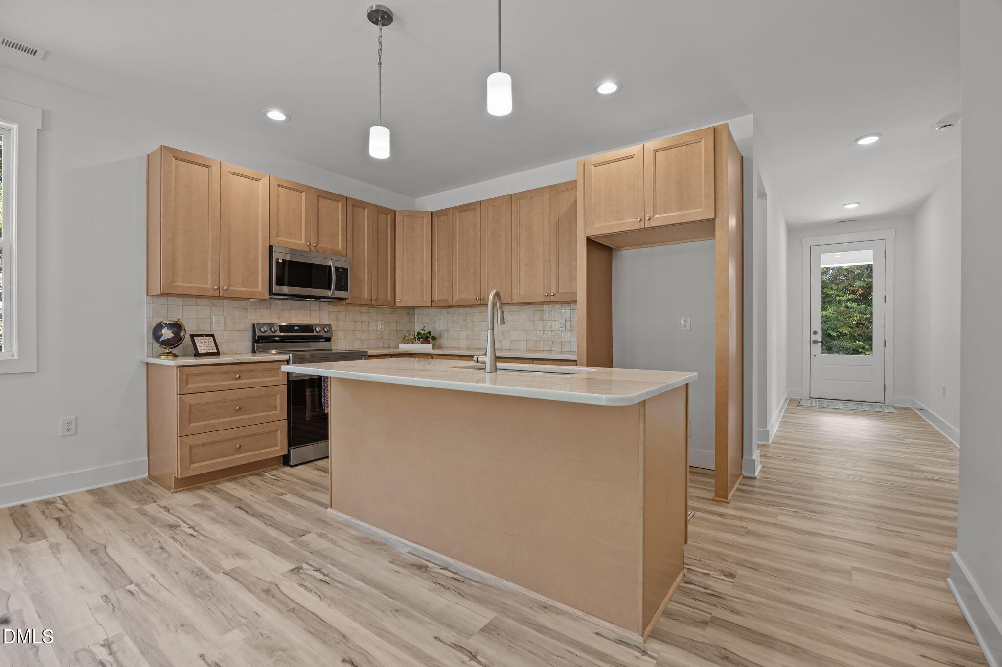 144 Howard Harris Road Franklinton, NC 27525 - Photo 4 of 21 a kitchen with kitchen island a sink stainless steel appliances and cabinets