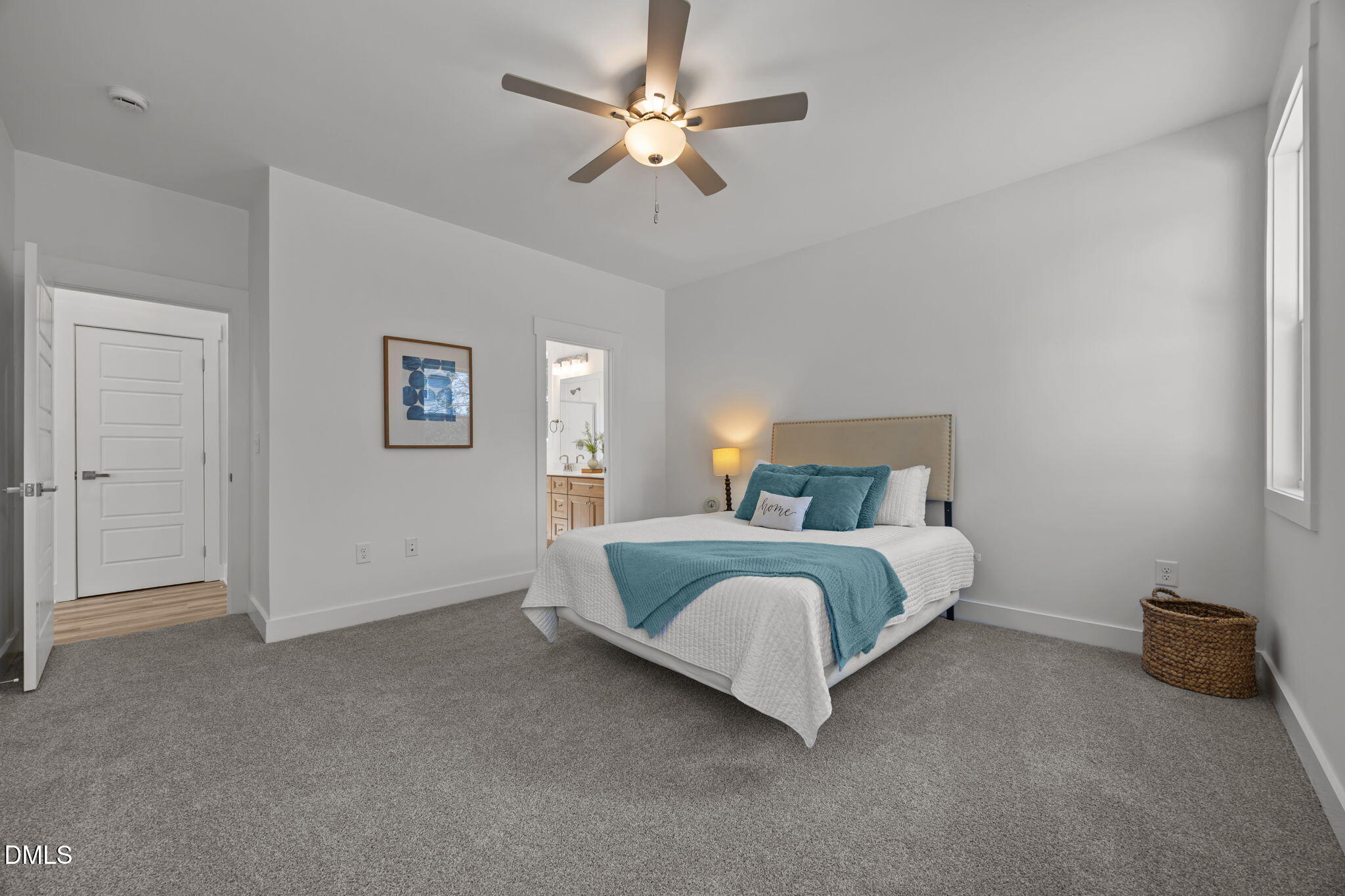 144 Howard Harris Road Franklinton, NC 27525 - Photo 10 of 21 a spacious bedroom with a bed and a chandelier