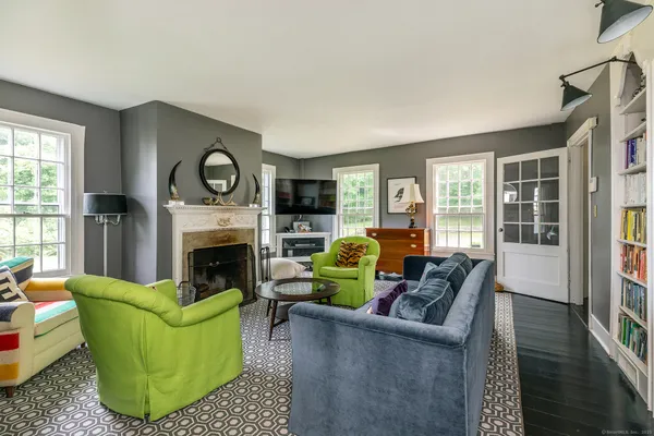 a living room with furniture and a fireplace