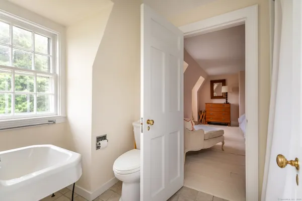 a bathroom with a sink toilet and tub