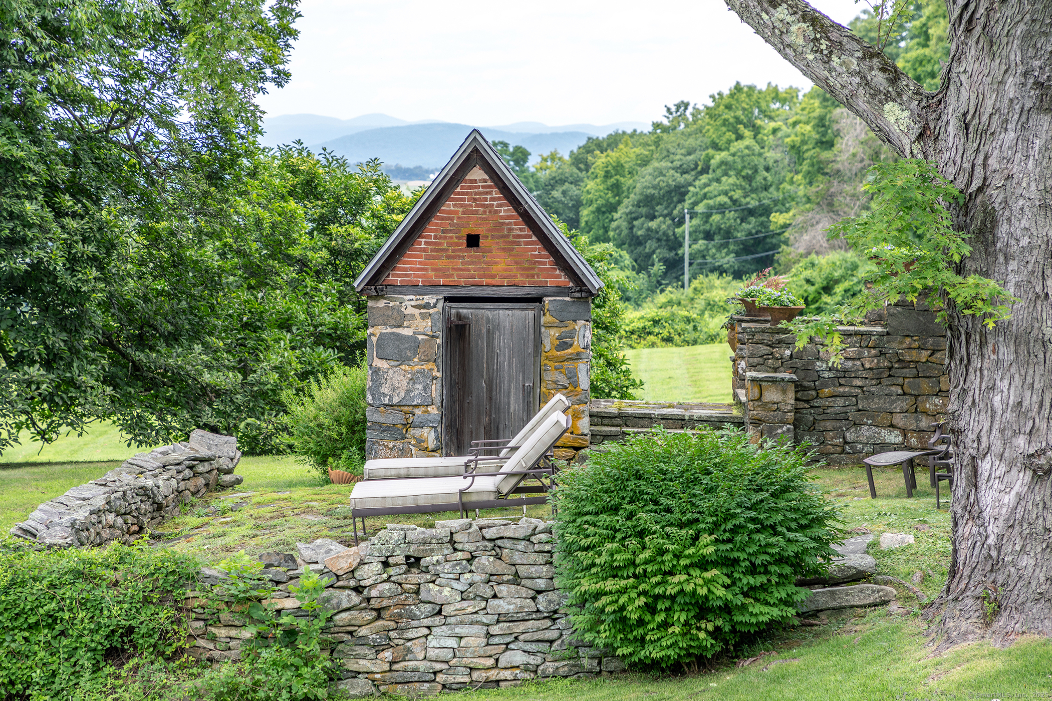 119 Knibloe Hill Road Sharon, CT 06069 - Photo 27 of 30 a front view of a house with a yard