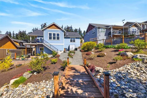 a aerial view of a house with a yard