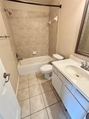 a view of front door and deck of house