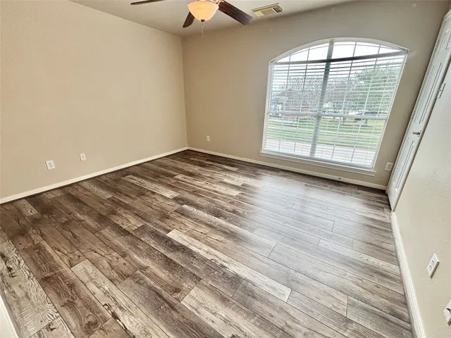 a view of a back yard from a balcony