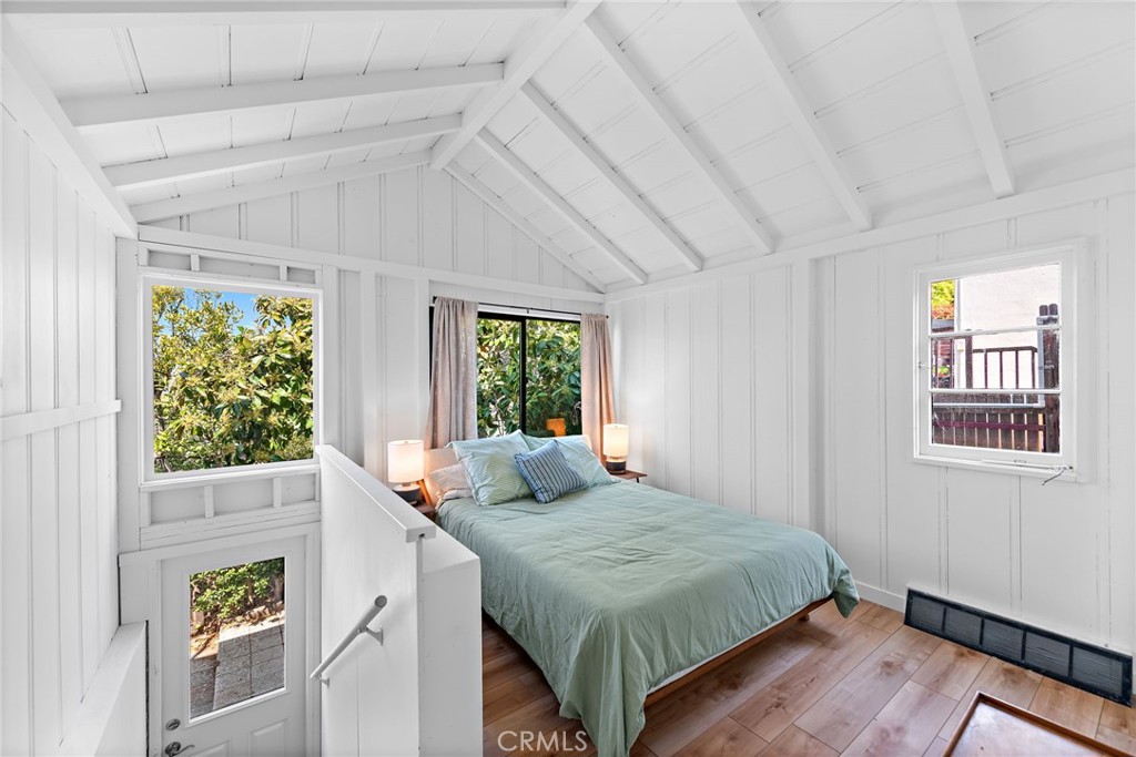 450 Ruby Street, Unit LOWR Laguna Beach, CA 92651 - Photo 12 of 22 a bedroom with a bed and a window
