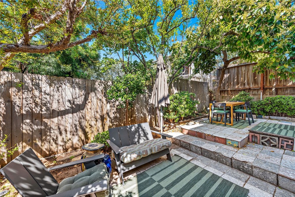 450 Ruby Street, Unit LOWR Laguna Beach, CA 92651 - Photo 14 of 22 a view of a backyard with sitting area