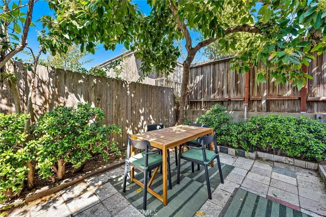 a table and chairs in front of a house