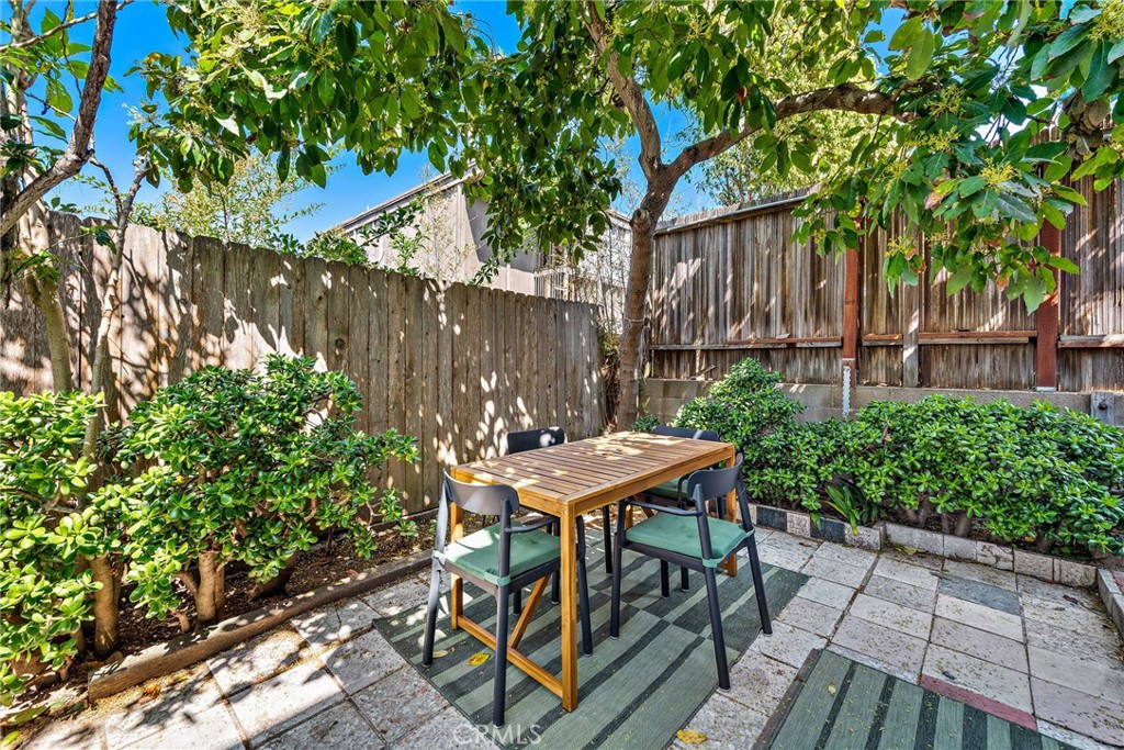 450 Ruby Street, Unit LOWR Laguna Beach, CA 92651 - Photo 15 of 22 a table and chairs in front of a house
