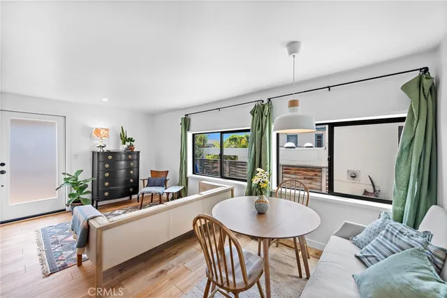 a living room with furniture a window and a chandelier