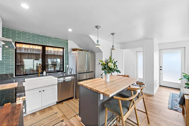 a kitchen with a table and chairs in it