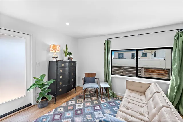 a balcony with furniture and potted plant