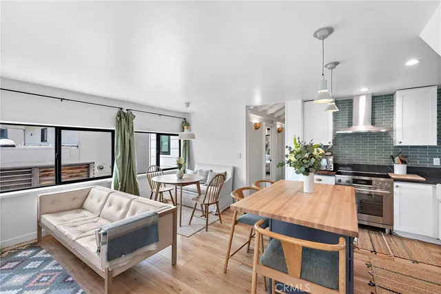 a kitchen with a table and chairs in it