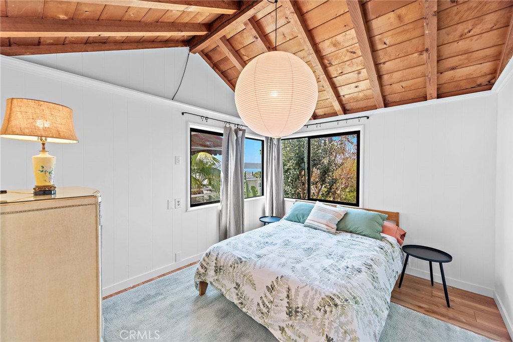 450 Ruby Street, Unit LOWR Laguna Beach, CA 92651 - Photo 9 of 22 a bedroom with a bed and a window
