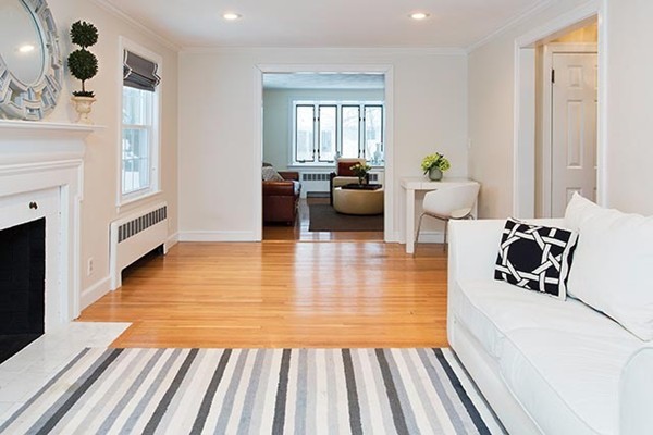 17 Hagen Road Newton, MA 02459 - Photo 2 of 10 a living room with furniture and a fireplace