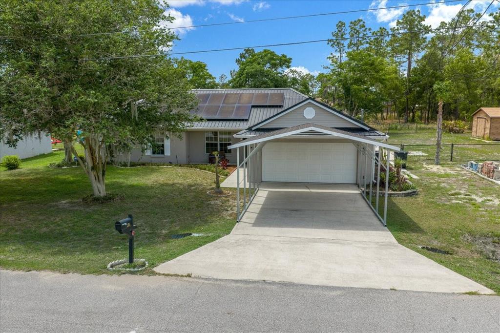 234 Locust Lane Ocala, FL 34472 - Photo 2 of 71 a house view with a garden space