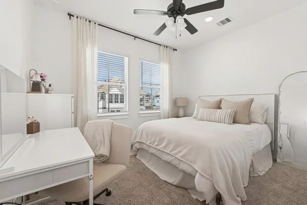 a bedroom with a bed and window