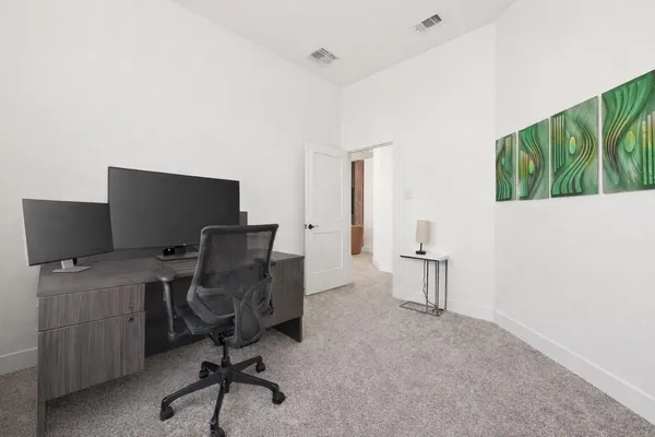 a view of a workspace with furniture