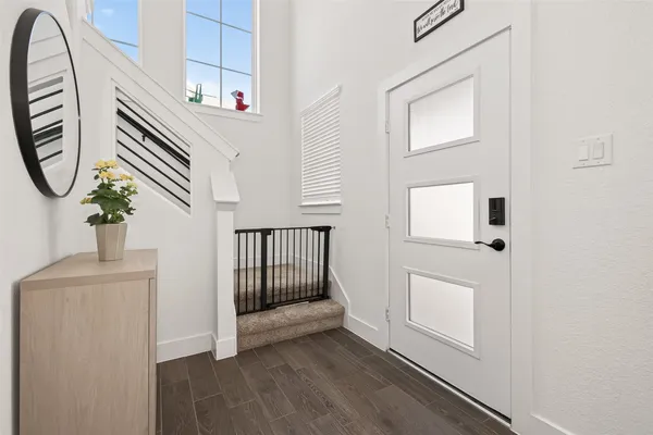 a view of a entryway with wooden floor