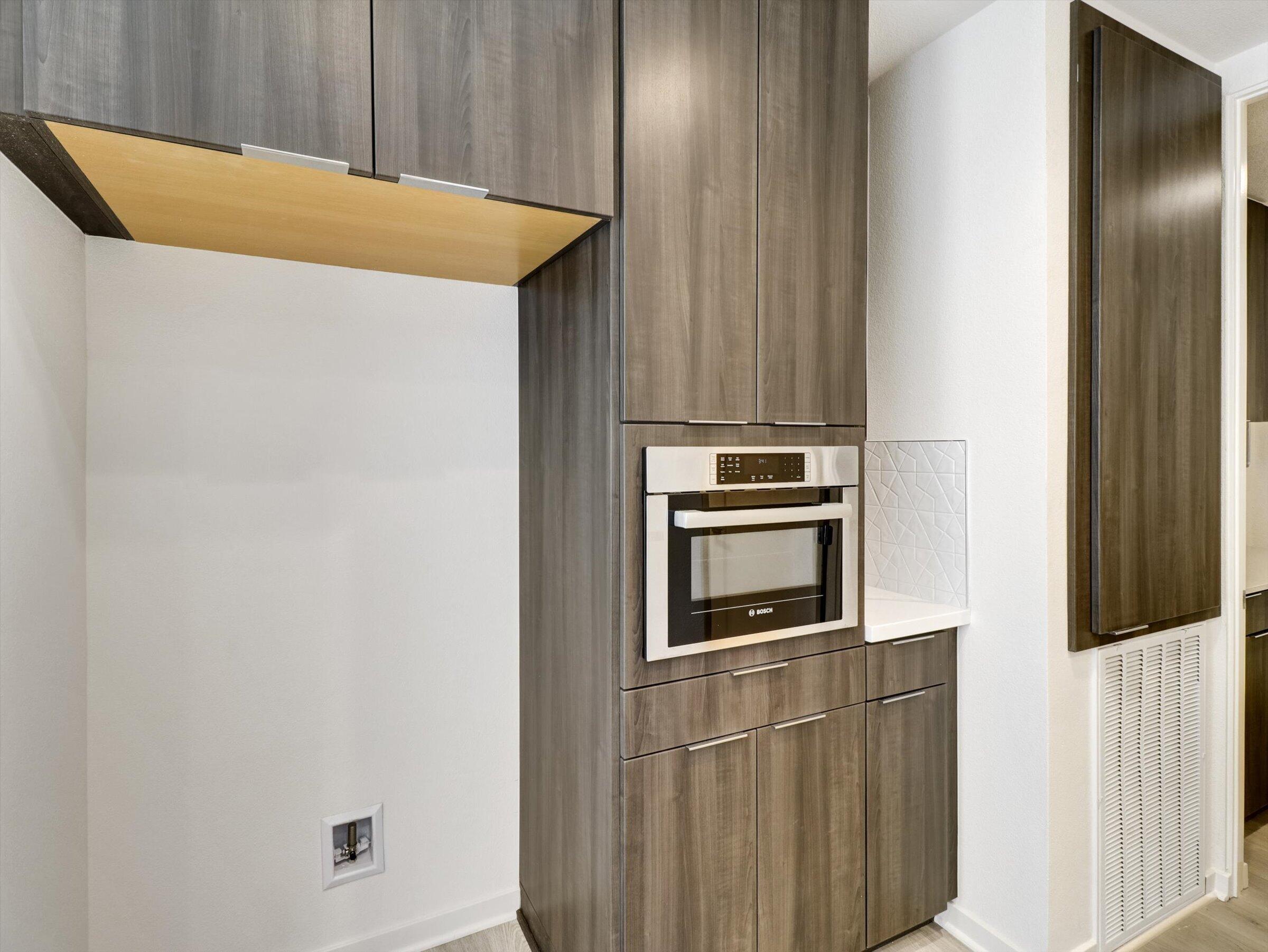 718 Obsidian Loop East, Unit 73 Palm Springs, CA 92264 - Photo 17 of 49 a kitchen with a refrigerator and microwave
