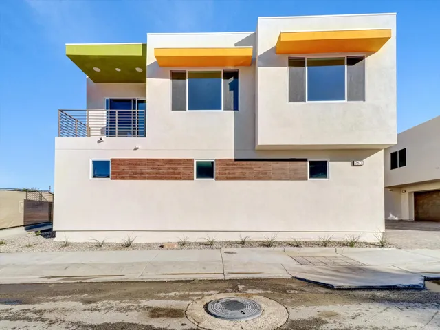 a view of a building with car parked