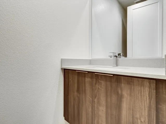 an empty room with wooden floor and a window