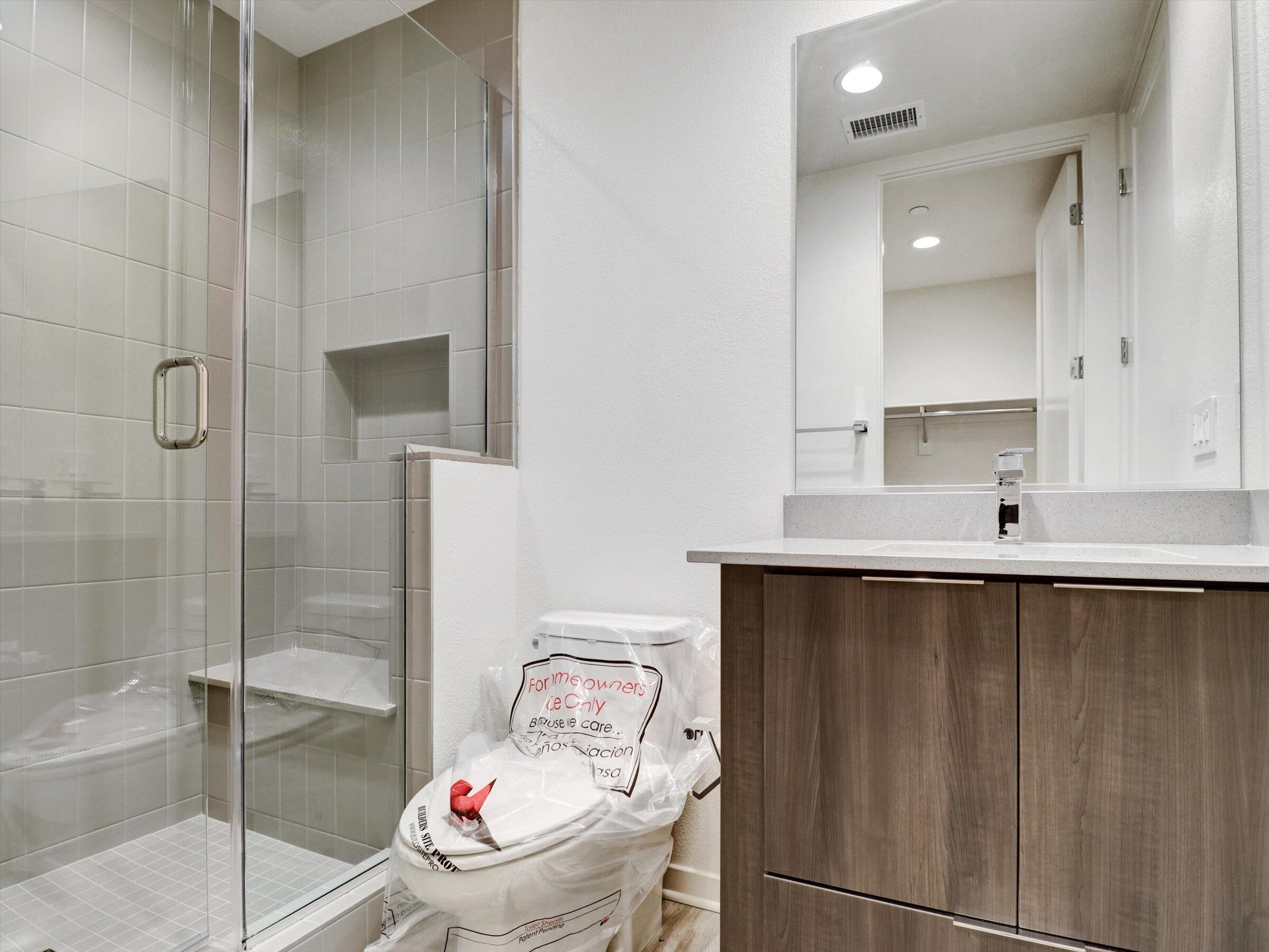 718 Obsidian Loop East, Unit 73 Palm Springs, CA 92264 - Photo 30 of 49 a bathroom with a sink and a mirror