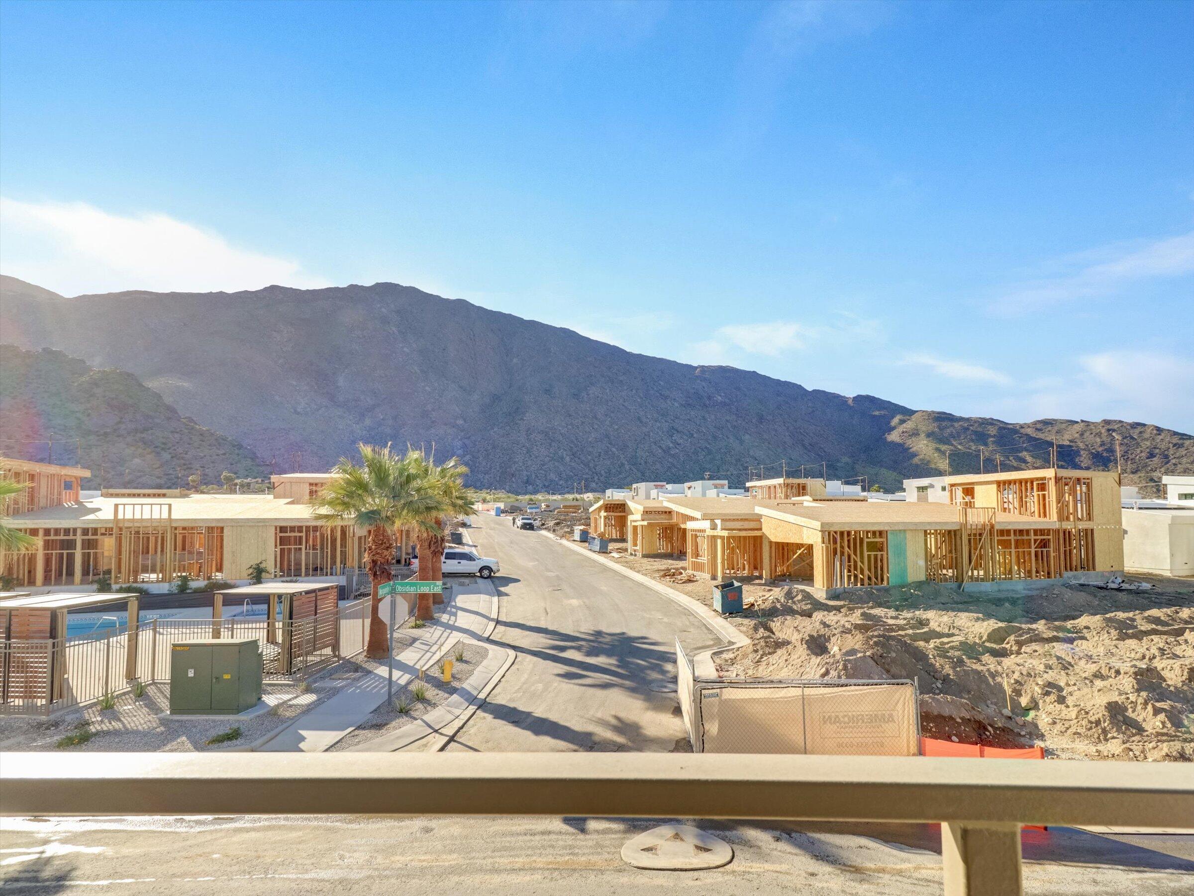 718 Obsidian Loop East, Unit 73 Palm Springs, CA 92264 - Photo 31 of 49 a view of houses with a lake view