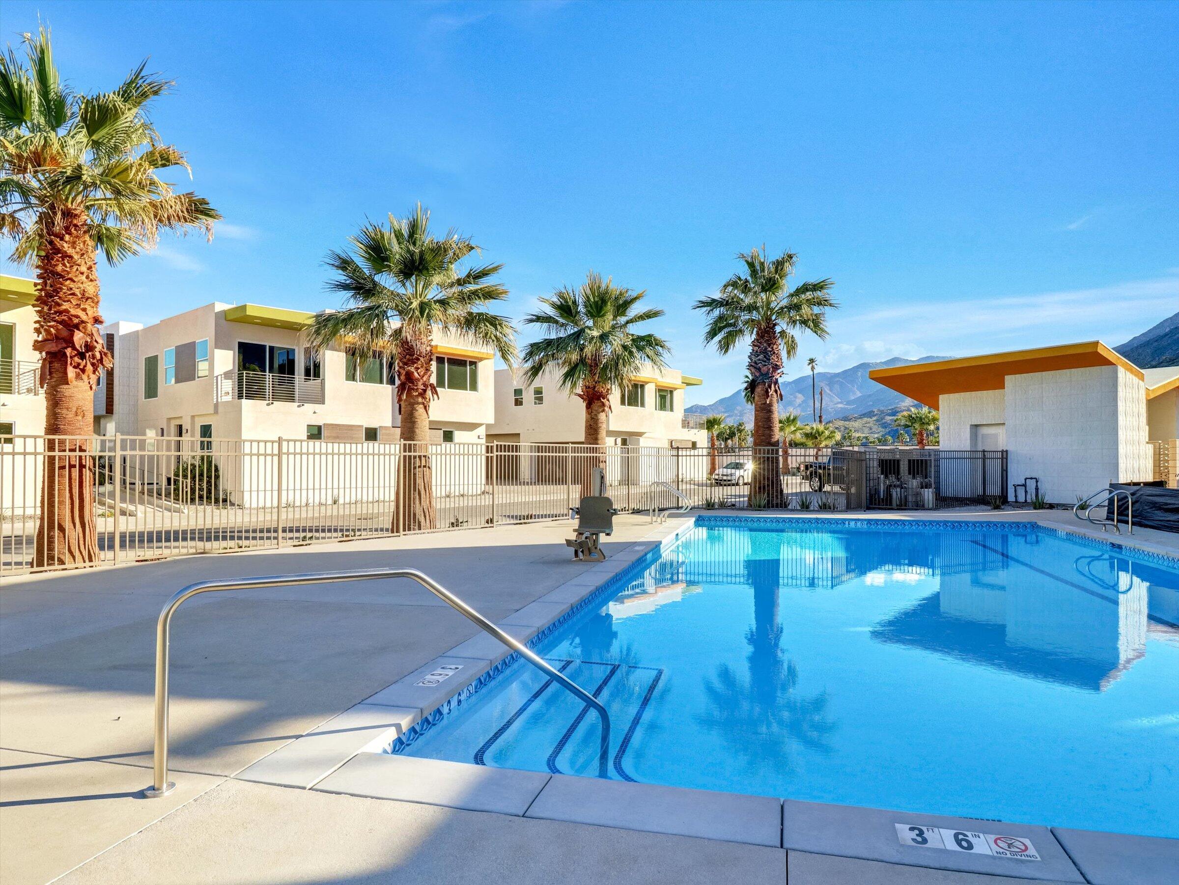 718 Obsidian Loop East, Unit 73 Palm Springs, CA 92264 - Photo 38 of 49 a swimming pool view with a outdoor seating