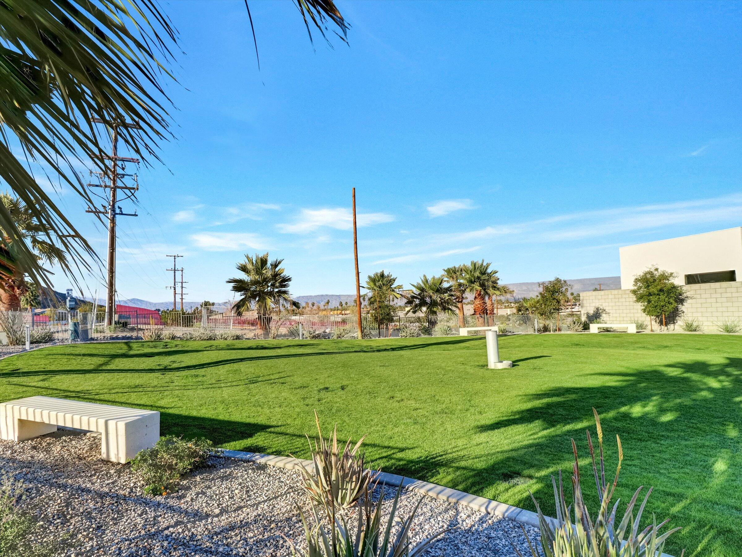 718 Obsidian Loop East, Unit 73 Palm Springs, CA 92264 - Photo 49 of 49 a view of a golf course with a garden