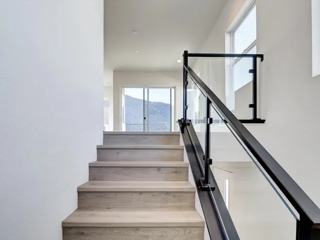 a view of kitchen with wooden floor and electronic appliances
