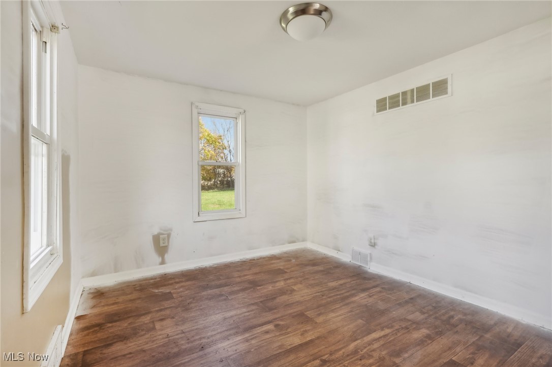 1733 Ronald Road Akron, OH 44312 - Photo 9 of 33 Unfurnished room with dark hardwood / wood-style floors