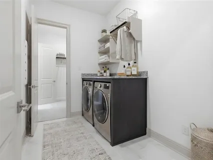 an aerial view of a house with a garden and lake view