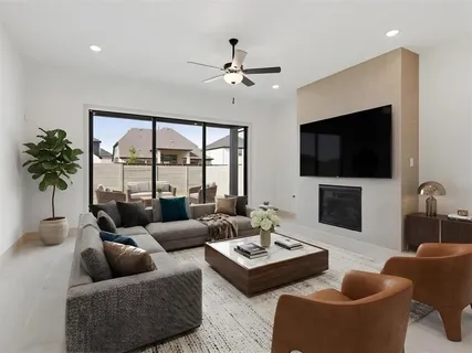 a spacious bedroom with a bed couch and a window