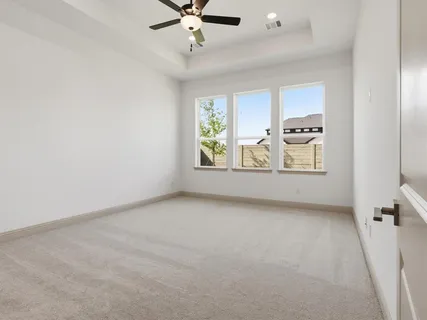 a bathroom with a shower and a glass door