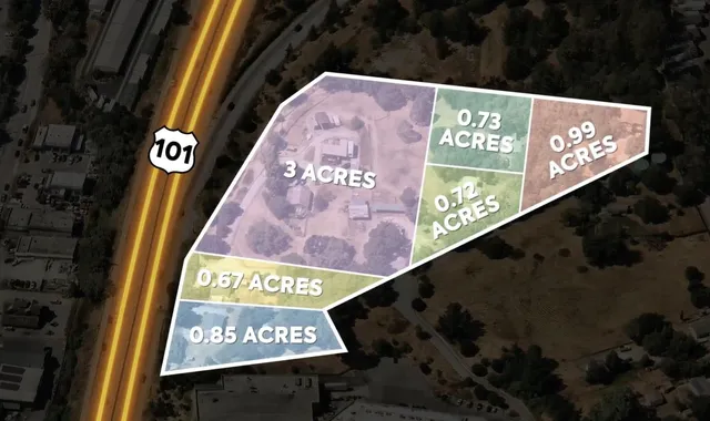 a view of a yard with wooden fence and a bench